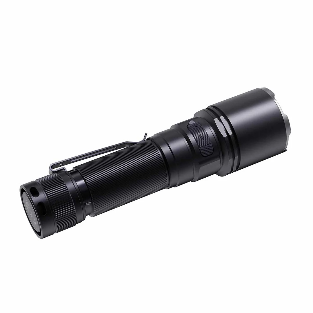 Black tactical flashlight with knurled grip and pocket clip lying diagonally.