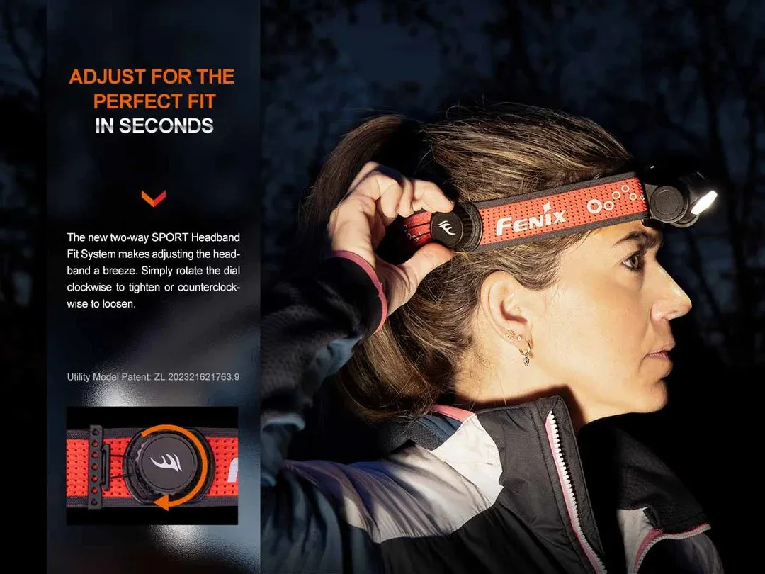 Woman in profile wearing a red Fenix headlamp headband with a front LED light, adjusting the fit against a dark outdoor background.