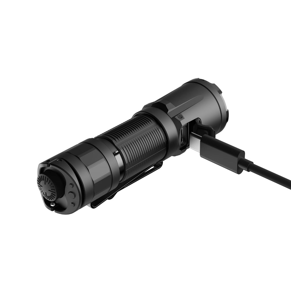 Black cylindrical handheld dive flashlight with textured grip and USB-C charging cable attached